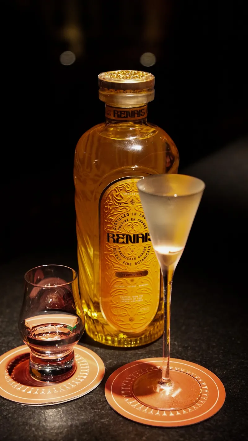 Gin bottle and chilled coupe photographed for a London bar menu